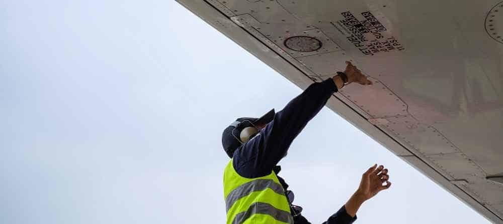 Man doing maintenance works on a plane