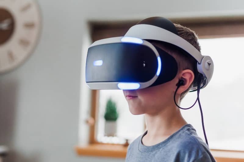 Boy wearing a Sony Playstation VR Headset